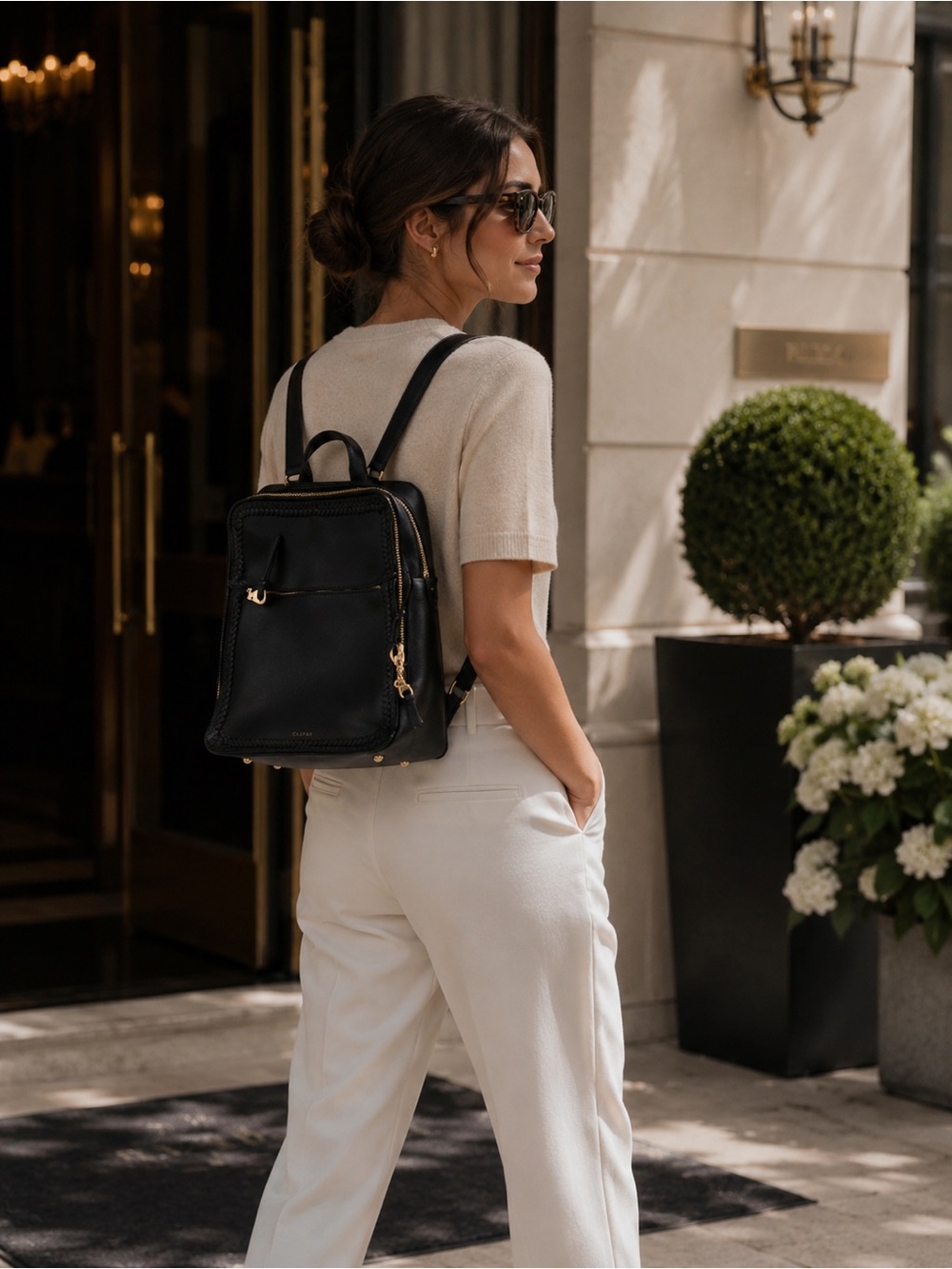 Calpak Black Backpack with Woven Trim and Gold Hardware